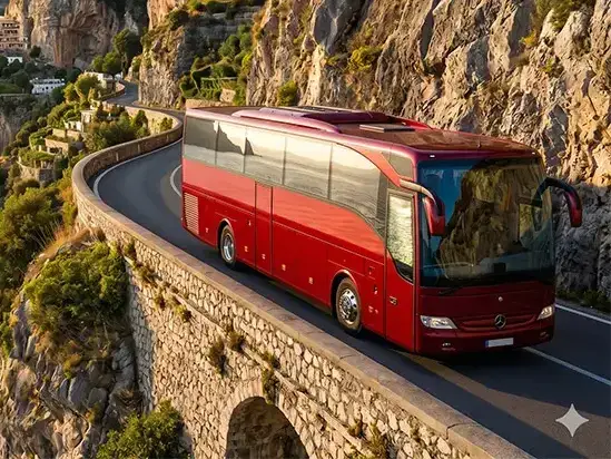 Our premium fleet of luxury Mercedes Vans, executive Minivans, and modern Grand Tourism Coaches parked along the Amalfi Coast highway